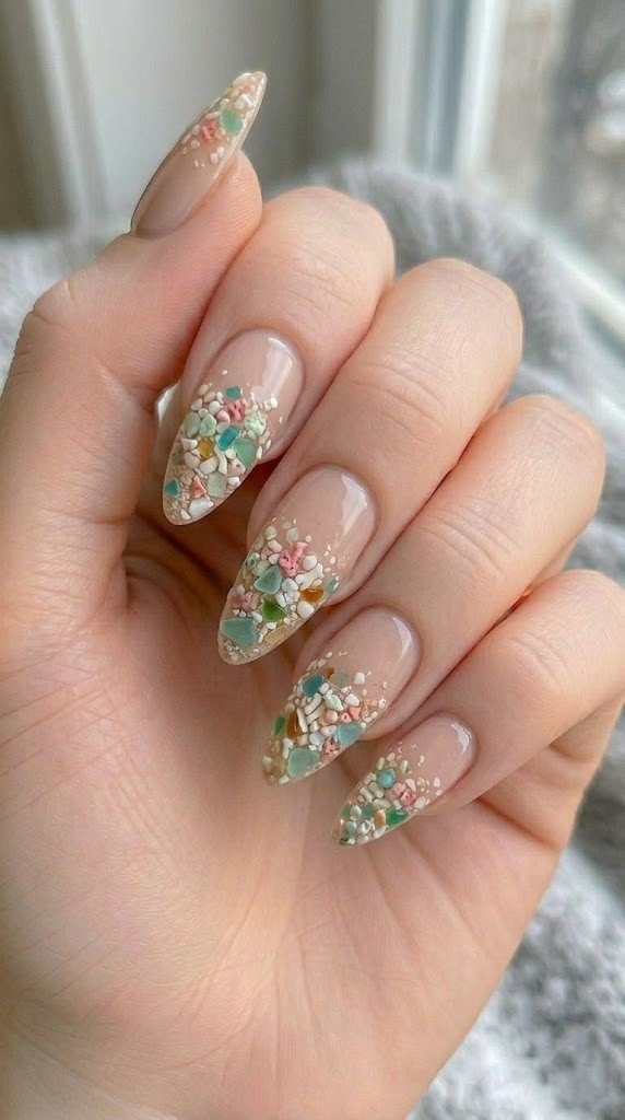sea glass and seashell beach nail designs on sheer nude pink almond nails