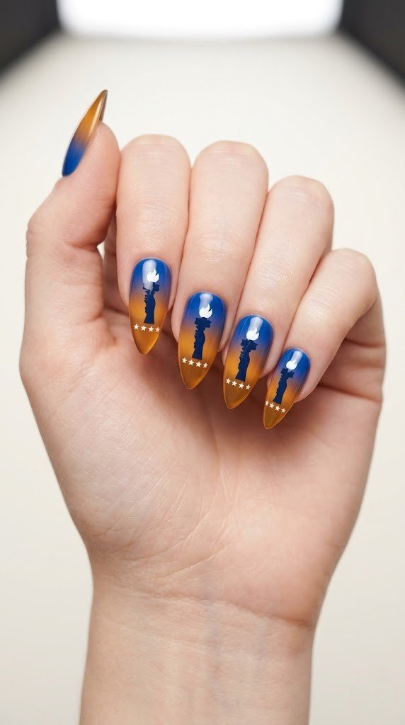 patriotic 4th of july nails with statue of liberty silhouette on royal blue to amber gradient