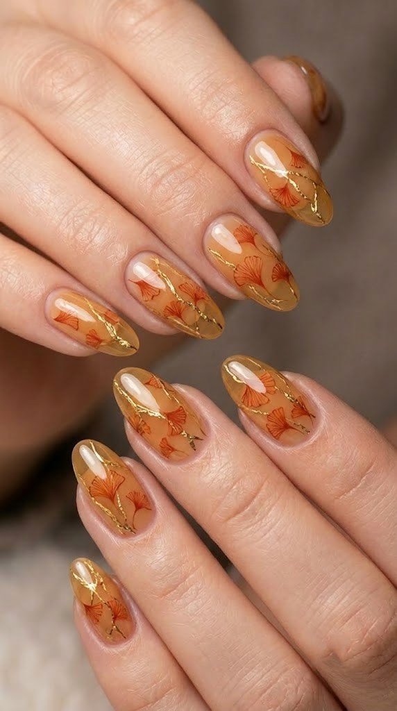 Harvest gilding fall nail ideas with gold leaf veining on almond nails